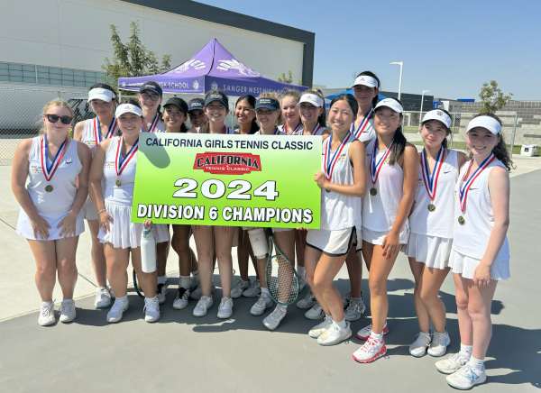 Varsity Tennis Holds California Classic Championship Banner